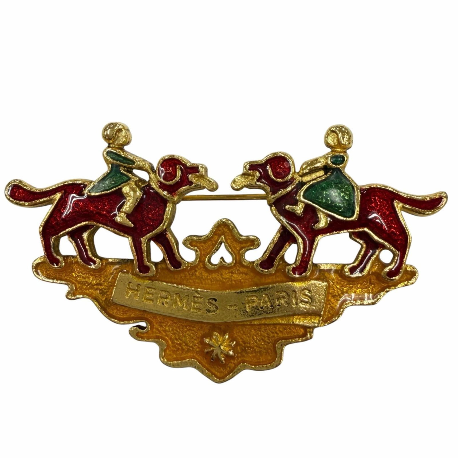 HERMES Brooch Metal: HERMES Brooch Metal Gently used Hermes brooch in gold, green, and red metal, featuring a unique metal design. The brooch measures 3.5cm x 6.5cm and is in very good condition with minor signs of wear, 