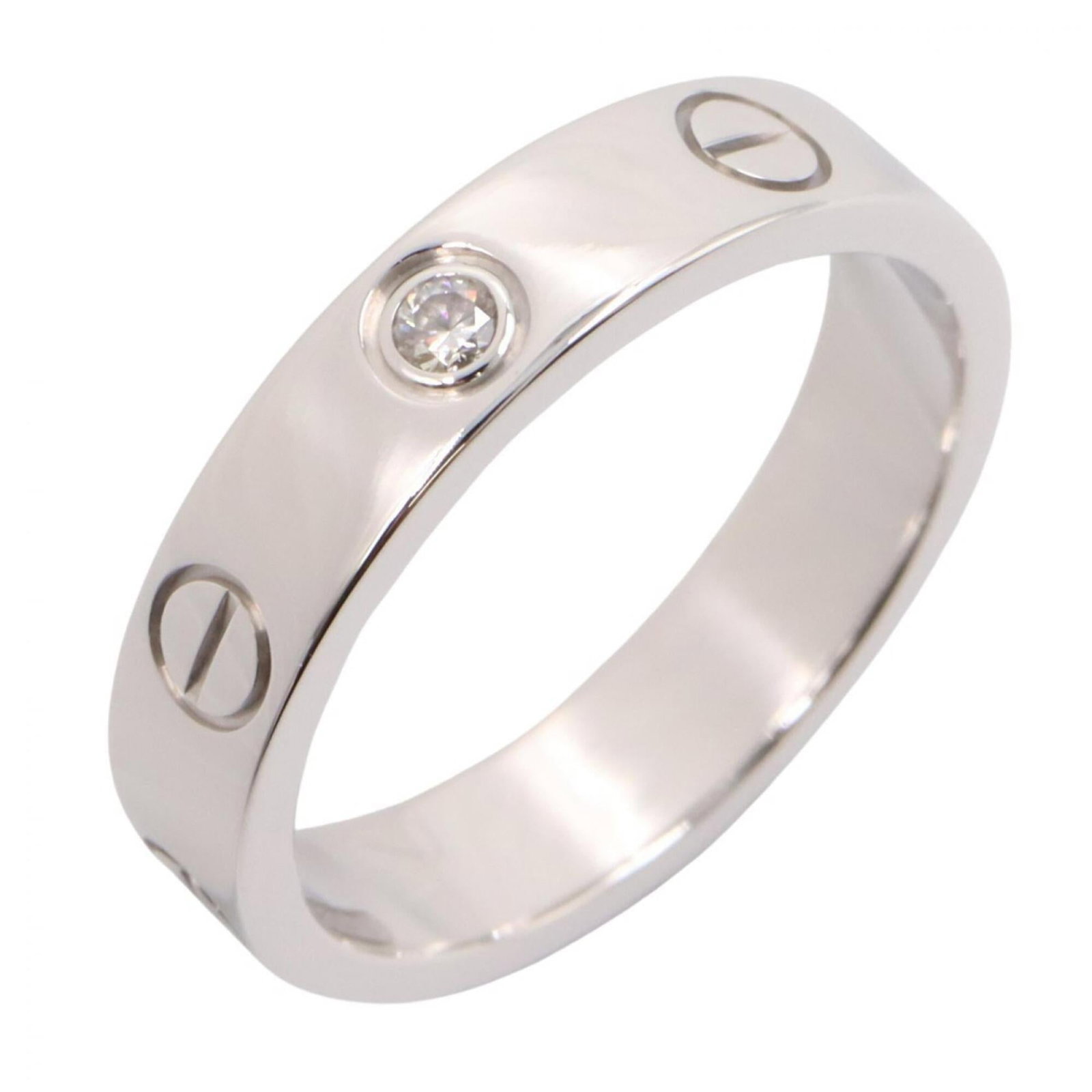 CARTIER Band Ring White Gold (18K): CARTIER Band Ring White Gold (18K) Cartier Band Ring White Gold (18K) is a stunning women's band ring featuring white gold (18K) and a diamond. The ring is in like new condition, with only the faintes