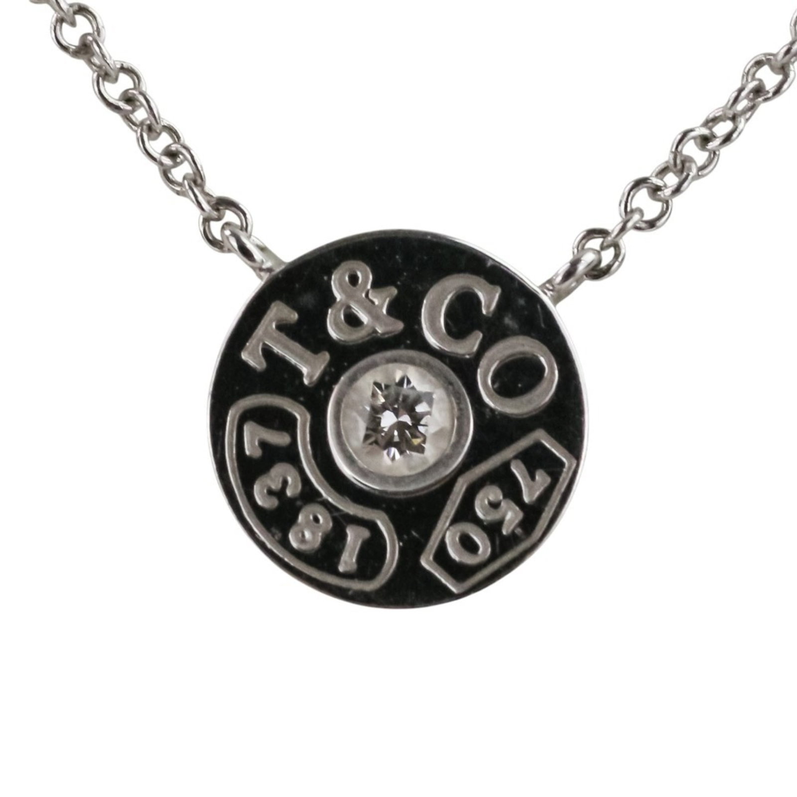 TIFFANY White Gold: TIFFANY White Gold White gold necklace with a 42 cm circumference, featuring a 8mm x 8mm diamond pendant, presented in a box and case. This like new used necklace boasts excellent condition with no vi