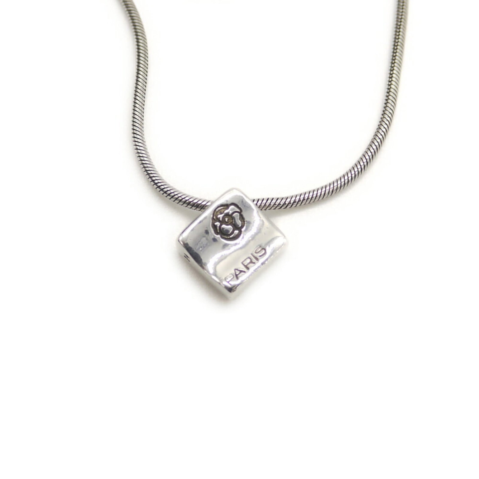 CHANEL Silver 925: CHANEL Silver 925 Silver 925 Chanel Pendant Necklace - A Timeless Classic. This beautiful 925 silver pendant necklace features the iconic Chanel design, showcasing the brand's signature elegance.