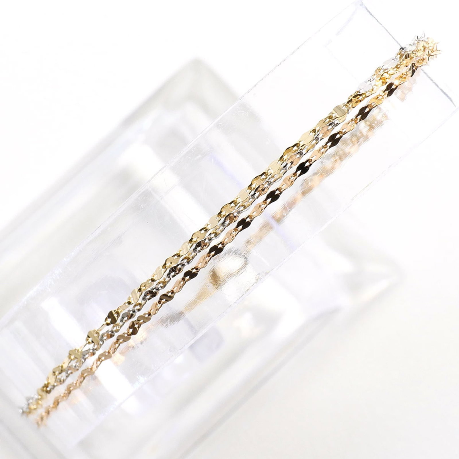 Charm Bracelet Pink Gold (10K) White Gold (10K) Yellow Gold (10K): Charm Bracelet Pink Gold (10K) White Gold (10K) Yellow Gold (10K) Pink gold, white gold, and yellow gold come together in a delicate charm bracelet, each metal type adding a touch of elegance to this