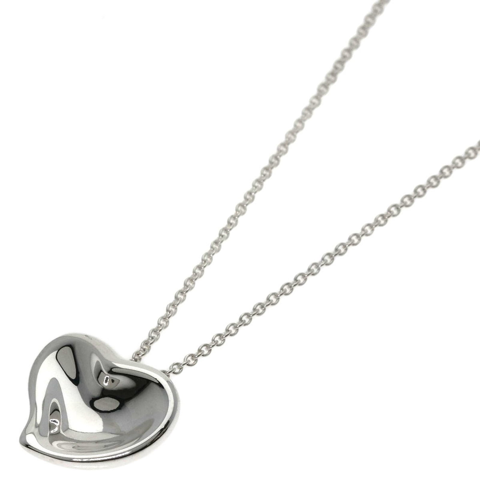 TIFFANY Silver Necklace: TIFFANY Silver Necklace Silver Tiffany necklace with a full heart pendant, measuring 12.6mm x 13.7mm, features a 40 cm chain circumference. This gently used piece showcases minor signs of wear,