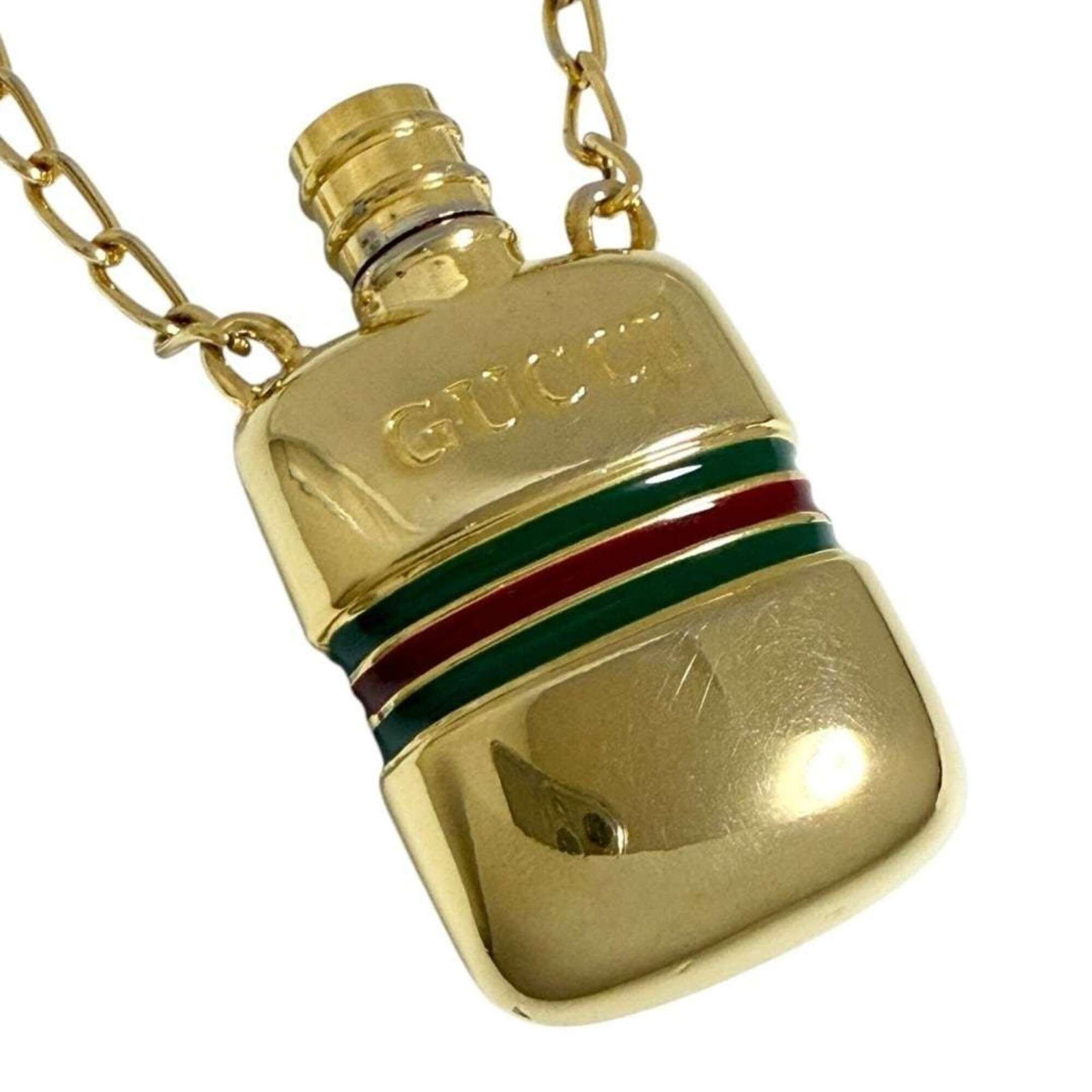GUCCI Metal Gold: GUCCI Metal Gold Gucci Metal Gold Pendant Necklace - A gently used, vintage pendant necklace with a gold metal finish, bearing a signature. The necklace features a classic design and is in very good c