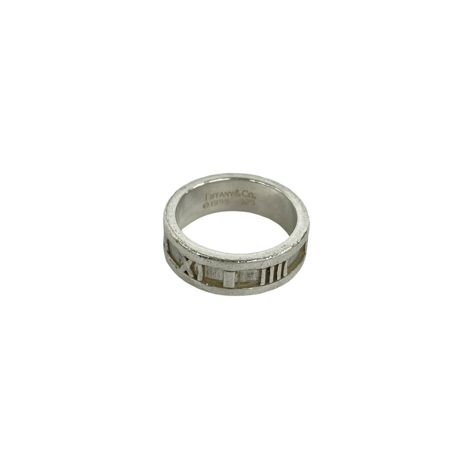 TIFFANY Band Ring Silver 925: TIFFANY Band Ring Silver 925 Silver 925 band ring from Tiffany, a classic design featuring a sleek and modern silhouette. The item bears visible signs of wear, including scratches and scuffs, but rema