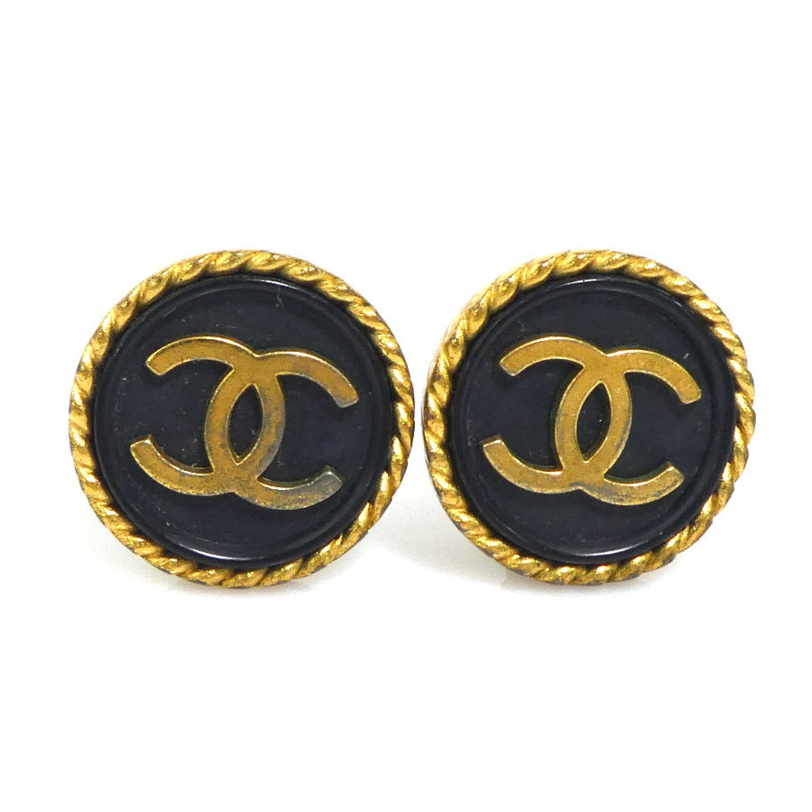 CHANEL Clip Earrings Metal Plastic: CHANEL Clip Earrings Metal Plastic Metal and plastic construction gives these CHANEL Clip Earrings a sleek, modern look. Made in France, they feature a black finish and a touch of gold detail. With vi