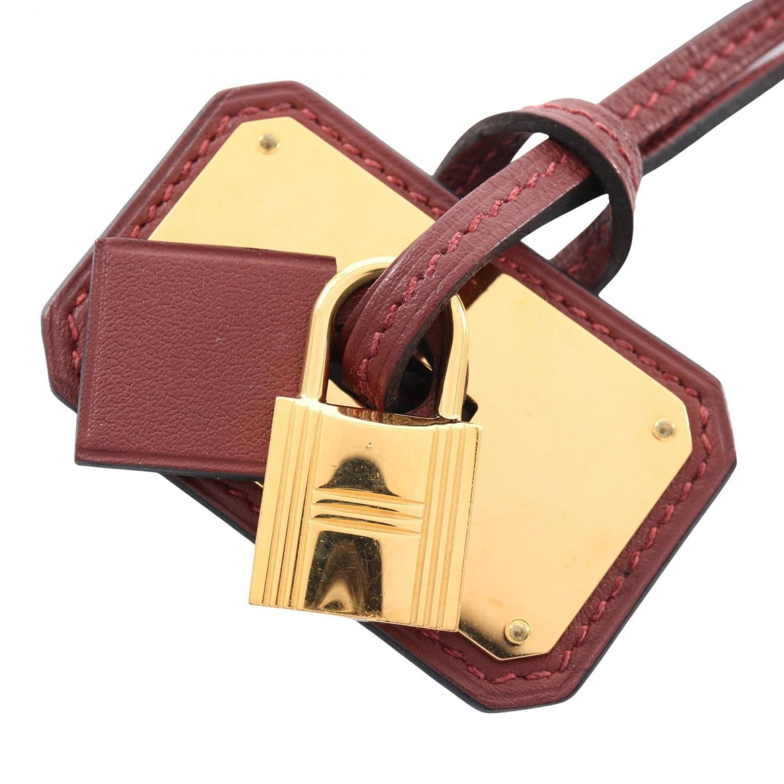 HERMES Leather Swift Leather: HERMES Leather Swift Leather Gently used Hermes Leather Swift Leather necklace in Bordeaux color, featuring a 35mm x 55mm pendant and adjustable 80cm chain. Minor signs of wear, including small scratc