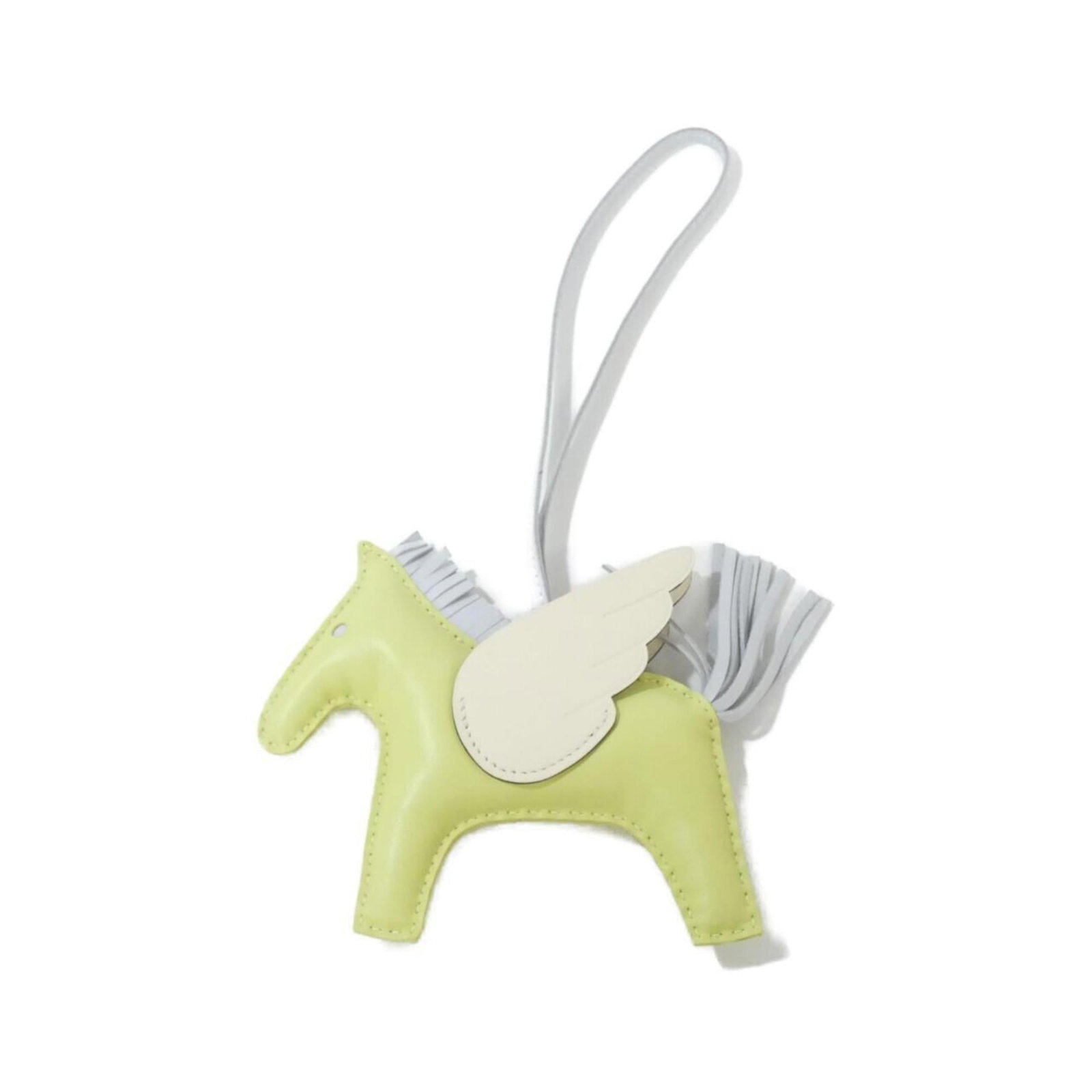 HERMES Handbag Charm Agneau Milo: HERMES Handbag Charm Agneau Milo Agneau Milo is a luxurious material used in this Hermes Handbag Charm, adding a touch of sophistication to any accessory. The charm's small scratches and light marks o