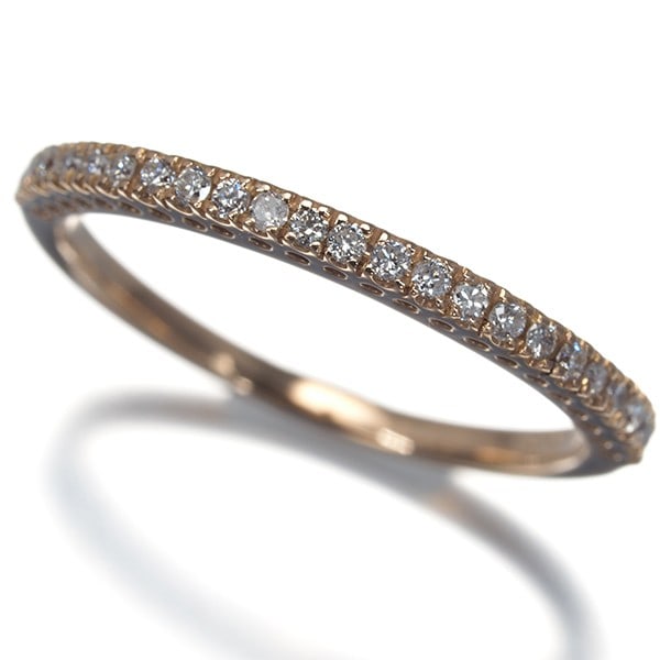 Diamond 0.15Ct Half Eternity Ring 18K 750 Rose Gold: Diamond 0.15Ct Half Eternity Ring 18K 750 Rose Gold Rose gold 18K 750 setting showcases a 0.15ct diamond, adding a touch of elegance to this understated ring. The 1.7mm wide band features a 1.4mm