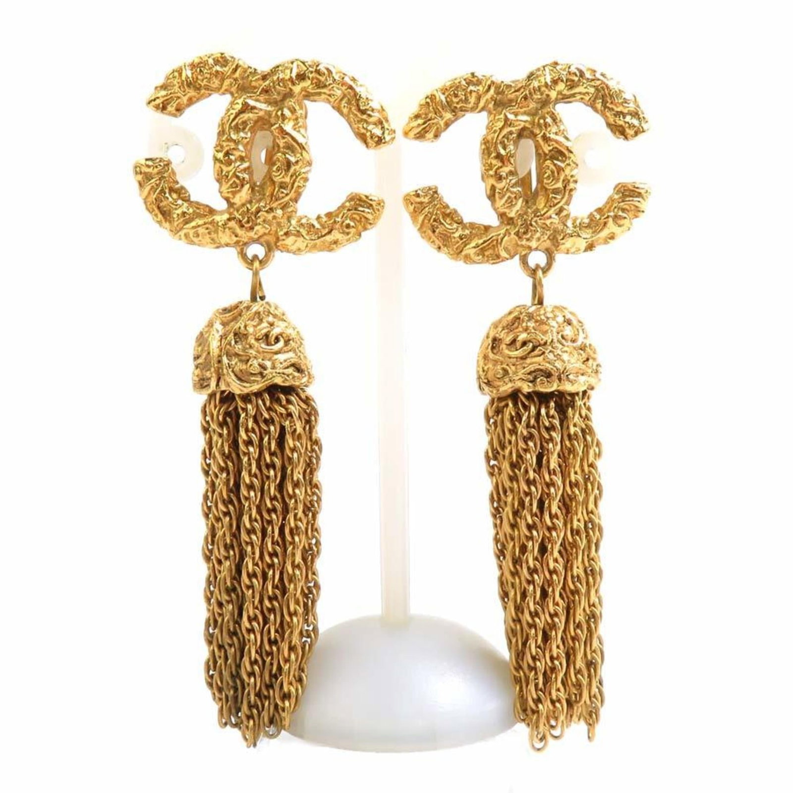 CHANEL Clip Earrings Metal: CHANEL Clip Earrings Metal Gold Clip Earrings from CHANEL, featuring a classic design with metal construction. The item bears visible wear, including scratches and scuffs, but remains fully