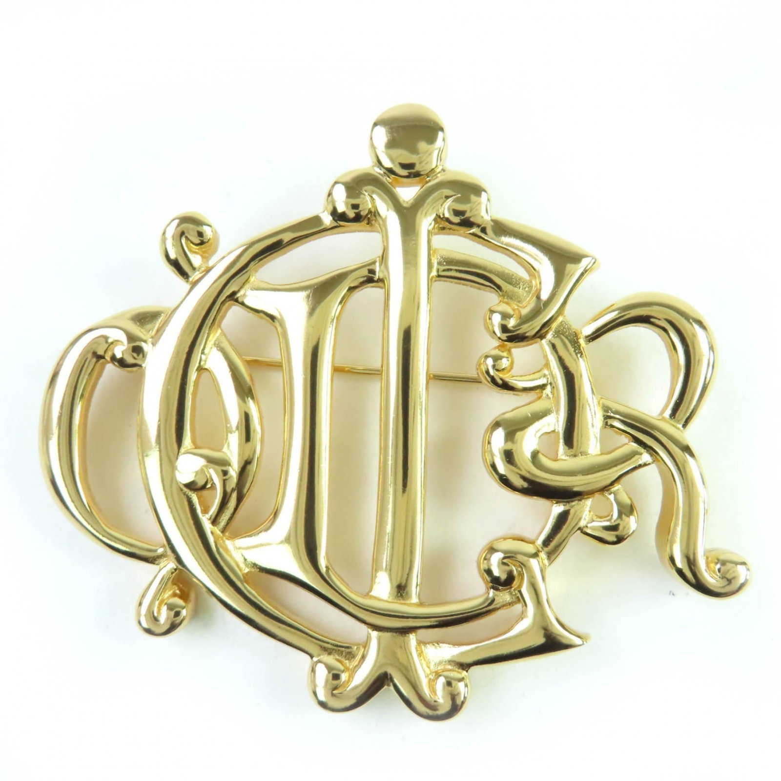 CHRISTIAN DIOR Brooch Gold: CHRISTIAN DIOR Brooch Gold Gold brooch from Christian Dior, 5.5cm x 6.5cm in size, bears a signature. In like new condition, with only the faintest traces of wear, this brooch is a gold piece from