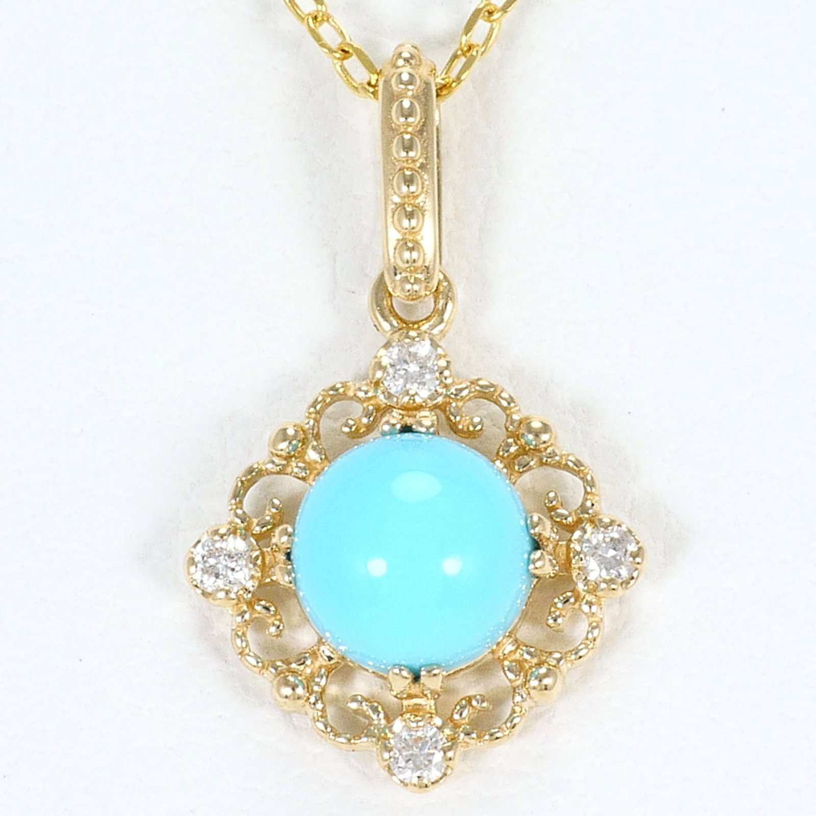 Yellow Gold (10K): Yellow Gold (10K) Yellow gold (10K) necklace with a 16mm x 8mm turquoise pendant, set in a sturdy chain with a 40 cm / 15.74'' neck circumference, weighing 1.1g / 0.03oz. The necklace is made from