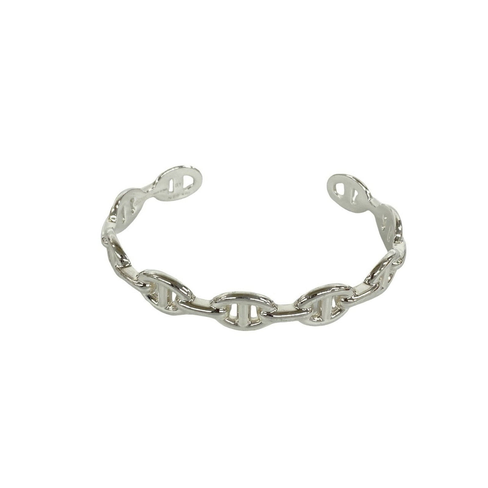 HERMES Bangle Silver 925: HERMES Bangle Silver 925 Silver 925 bangle from Hermes, featuring a classic design with visible scratches and scuffs from previous use. The bangle measures 16.5cm in length and is made from high-quali