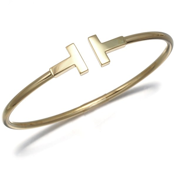 Tiffany&Co. Bracelet Tiffany T Wire Bangle 18K 750 Yellow Gold: Tiffany&Co. Bracelet Tiffany T Wire Bangle 18K 750 Yellow Gold 18K yellow gold Tiffany & Co. bracelet features a classic Tiffany T wire bangle design. The 18k gold construction provides a luxurious fe