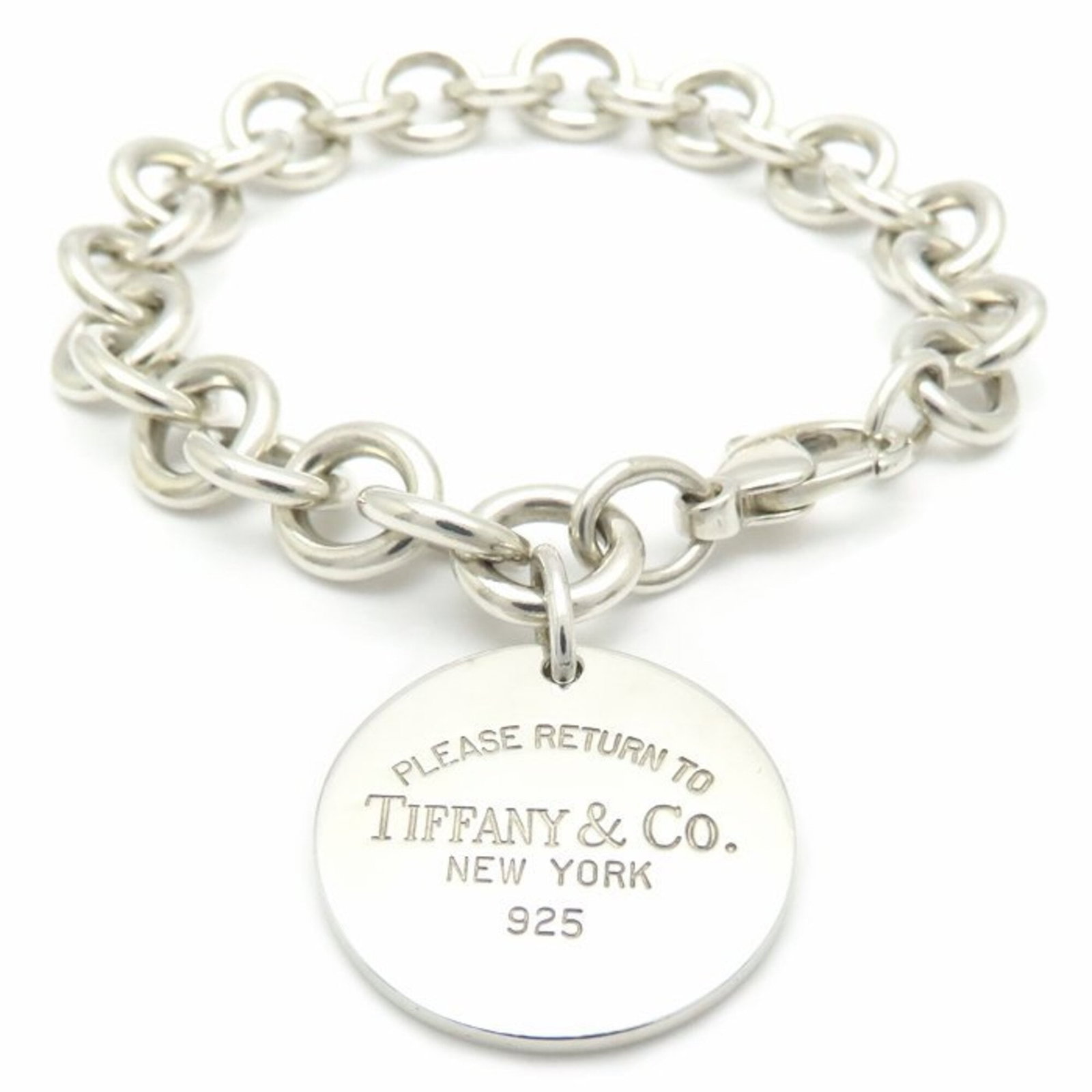 TIFFANY Charm Bracelet Silver 925: TIFFANY Charm Bracelet Silver 925 Silver 925 Charm Bracelet from Tiffany, featuring a delicate design with minor signs of wear, small scratches, and light marks. The bracelet measures 17cm in length a