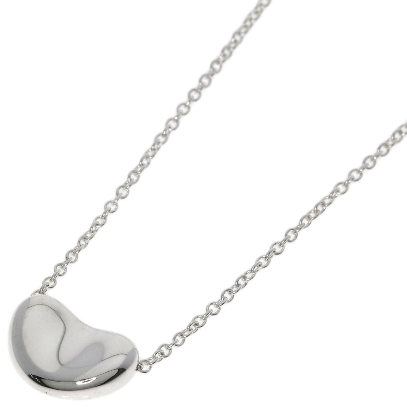 TIFFANY Silver Necklace: TIFFANY Silver Necklace Tiffany Silver Necklace, a beautiful piece of jewelry featuring a 7.5mm x 10.8mm silver pendant, is available for purchase. This gently used necklace has a 43 cm circumference 