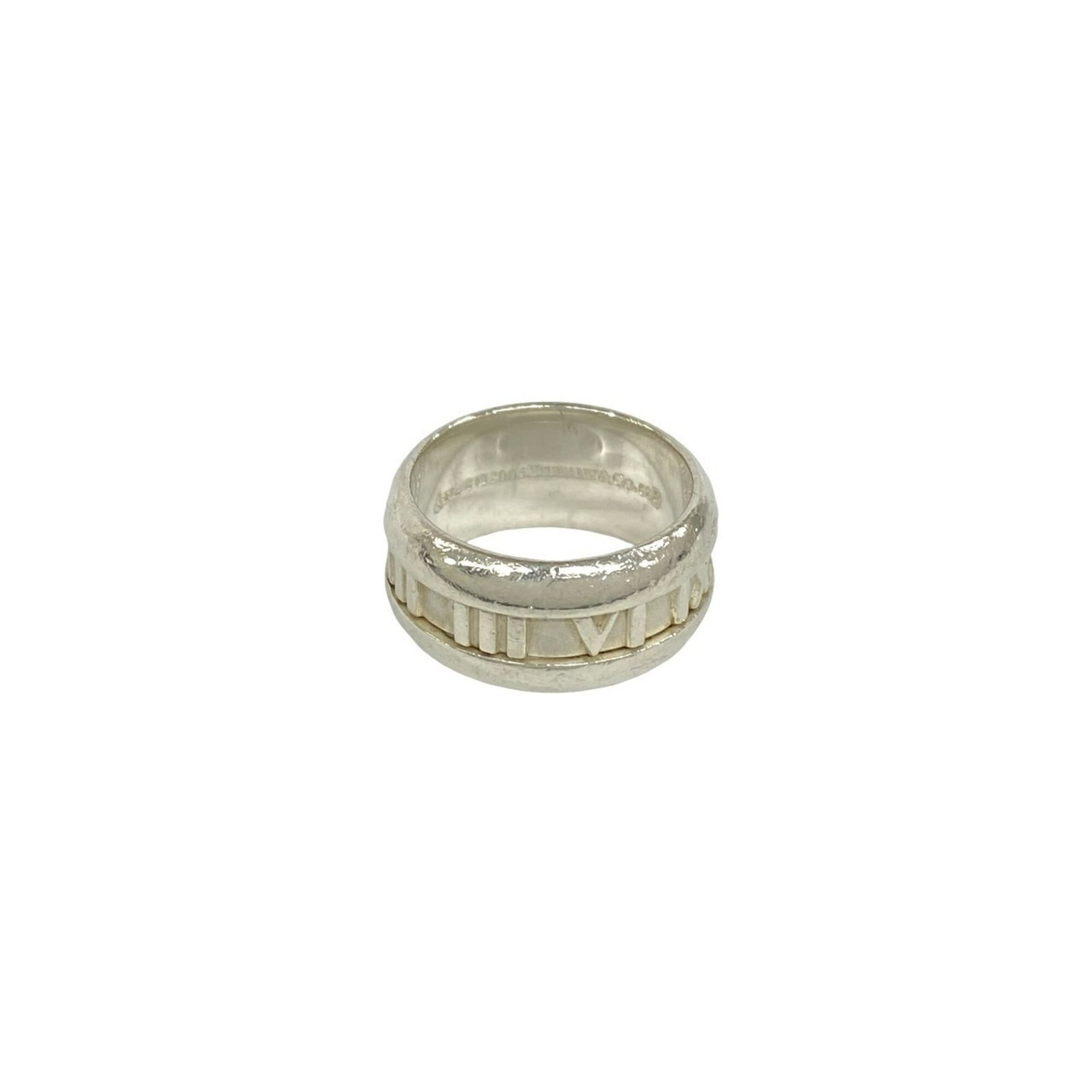 TIFFANY Band Ring Silver 925: TIFFANY Band Ring Silver 925 Silver 925 band ring from Tiffany, a classic design featuring a sleek and modern silhouette. The item bears visible signs of wear, including scratches and scuffs, but rema