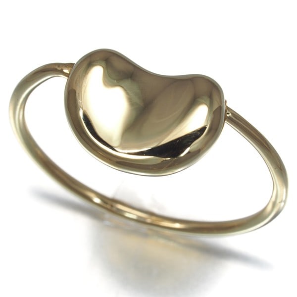 Tiffany&Co. Ring Bean Us5.25-5.5 18K 750 Yellow Gold: Tiffany&Co. Ring Bean Us5.25-5.5 18K 750 Yellow Gold Tiffany&Co.'s 18K yellow gold Bean Ring boasts a sleek design width of 8.0mm and a base metal of 1.2mm, showcasing the brand's signature style.