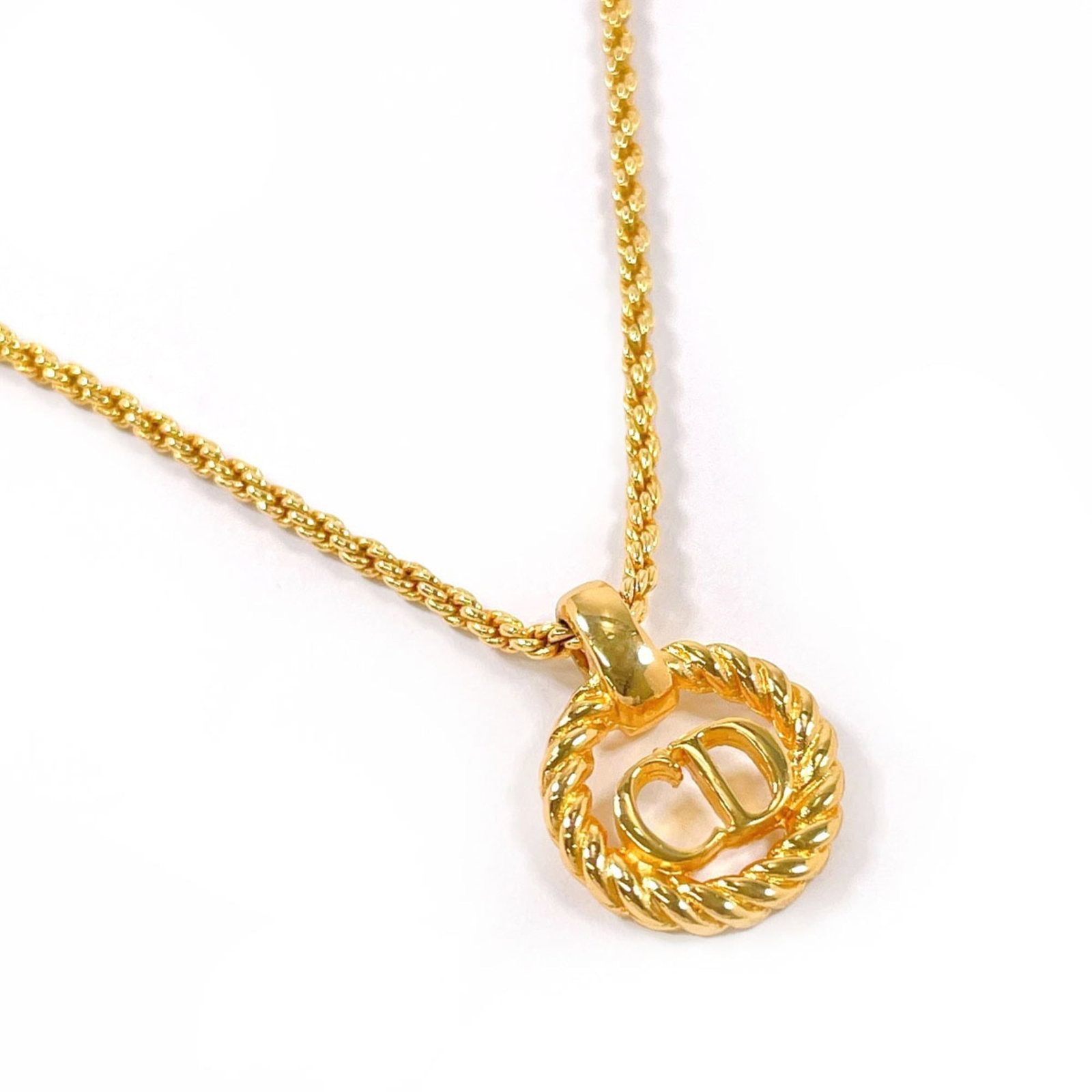 CHRISTIAN DIOR Gold Plating: CHRISTIAN DIOR Gold Plating Gold plating adds a touch of luxury to this Christian Dior necklace, featuring a 44 cm adjustable chain and a 15.5mm x 12mm pendant. The item bears minor signs of wear,