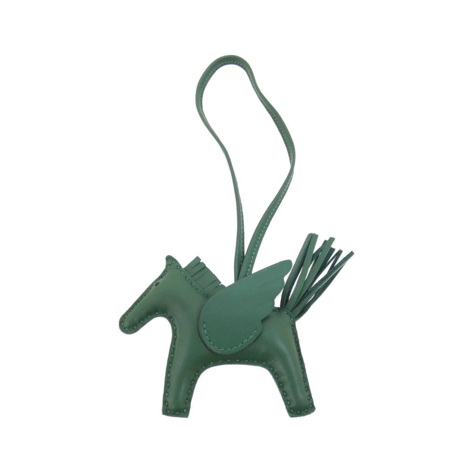 HERMES Handbag Charm Agneau Milo: HERMES Handbag Charm Agneau Milo Agneau Milo, a unique and stylish handbag charm from the renowned French fashion house Hermes, adds a touch of elegance to any bag. This green Agneau Milo charm