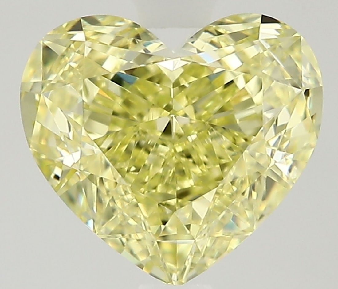 GIA Heart 1.56ct Fancy Yellow VVS1 - Loose Natural Diamond: GIA Heart 1.56ct Fancy Yellow VVS1 - Loose Natural Diamond GIA certifies this 1.56ct Fancy Yellow VVS1 diamond, showcasing exceptional clarity and a vibrant yellow hue. Measuring 6.6L x 7.29W x