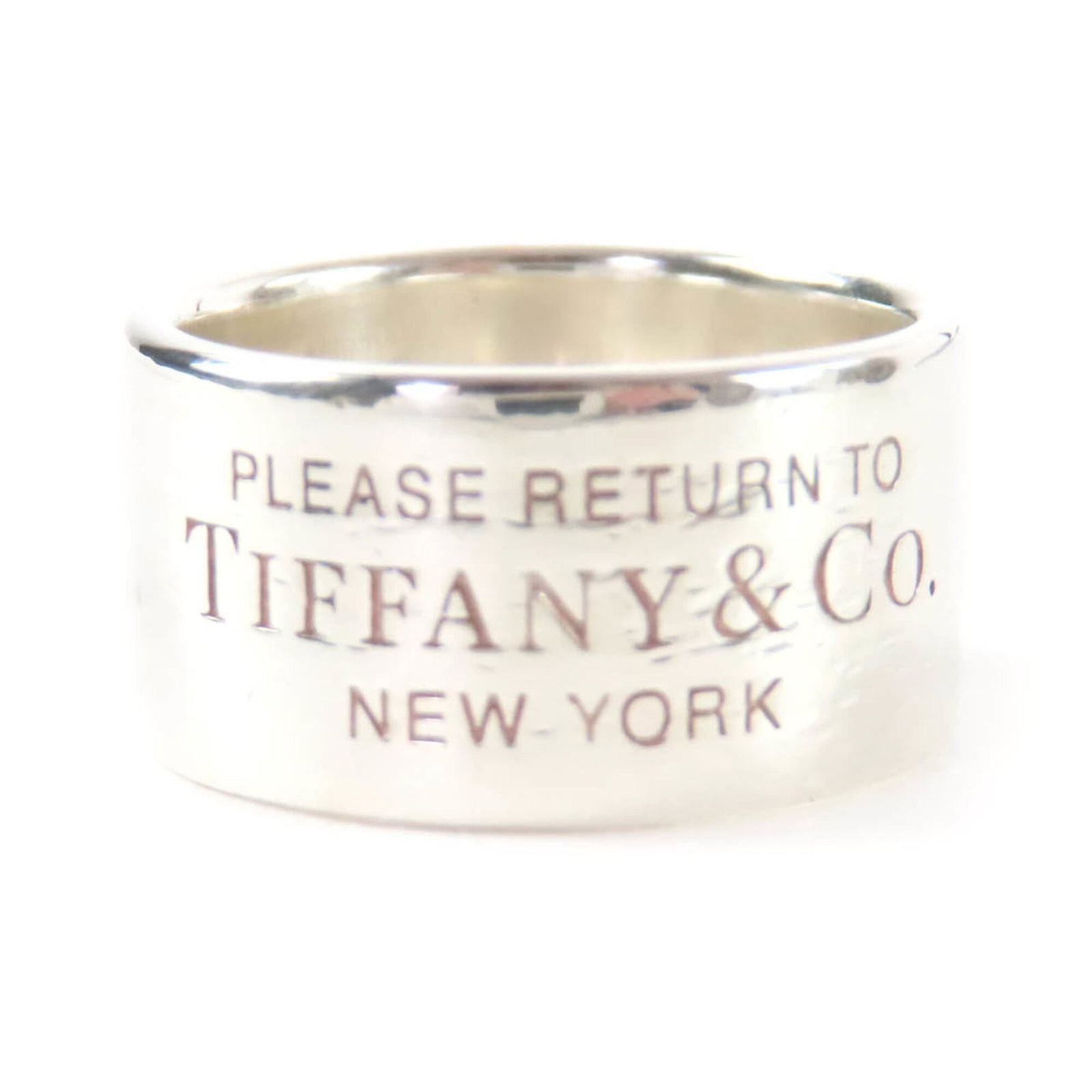 TIFFANY Band Ring Silver 925: TIFFANY Band Ring Silver 925 Silver 925 band ring from Tiffany, featuring a sleek design with a subtle width of 9mm. This pre-owned ring showcases a good condition with visible scratches and scuffs,