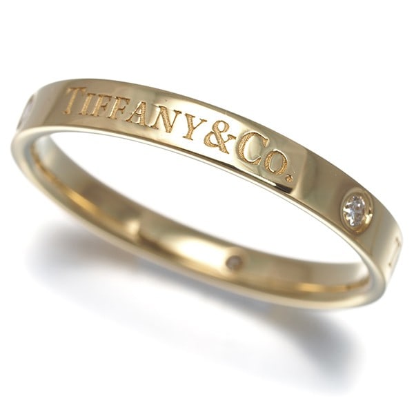 Tiffany&Co. Ring Diamond Flat Band 3P Us9.25-9.5 18K 750 Yellow Gold: Tiffany&Co. Ring Diamond Flat Band 3P Us9.25-9.5 18K 750 Yellow Gold Tiffany & Co.'s iconic flat band ring showcases a beautiful 18k yellow gold setting, expertly crafted to highlight the natural bril