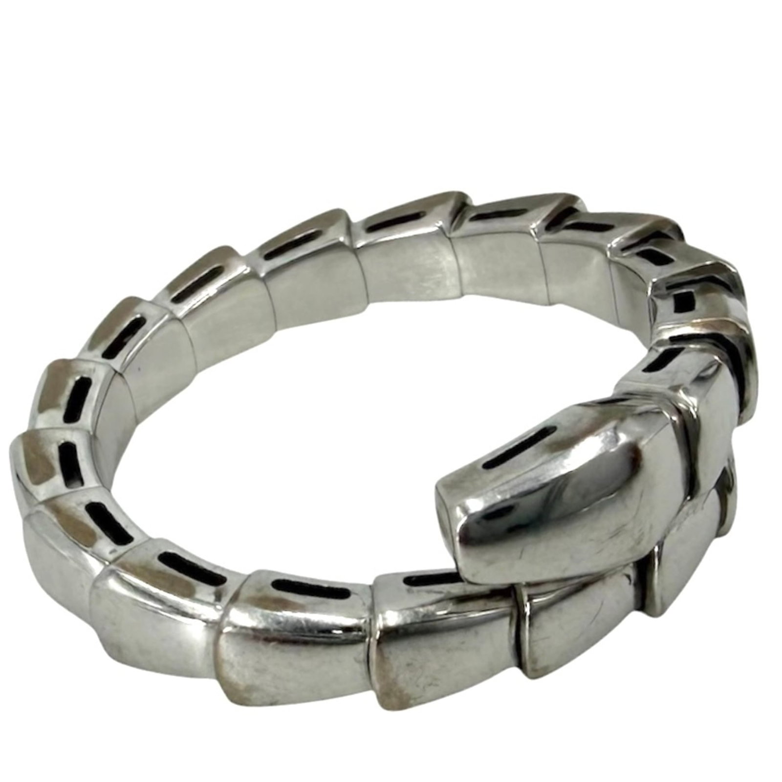 BVLGARI White Gold: BVLGARI White Gold White gold BVLGARI watch features a classic design with visible wear, scratches, and scuffs, and is in good overall condition. The item is fully functional and bears a signature.