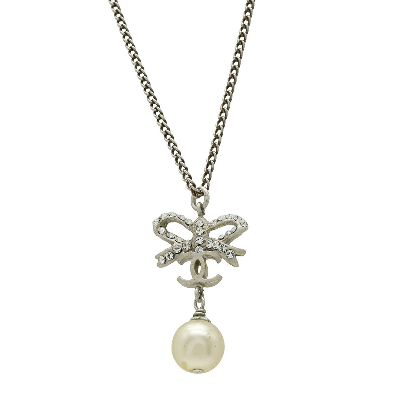 CHANEL Artificial Pearl Metal Rhinestone: CHANEL Artificial Pearl Metal Rhinestone Artificial pearl, metal, and rhinestone come together in this elegant CHANEL necklace, featuring a 31mm x 20mm pendant in an ivory and silver finish. The