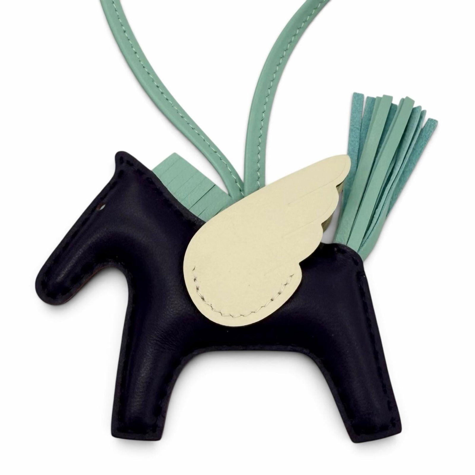 HERMES Handbag Charm Agneau Milo Swift Leather: HERMES Handbag Charm Agneau Milo Swift Leather Agneau Milo Swift Leather Handbag Charm from Hermes, a French luxury brand, features a unique combination of beige, mint green, and violet hues. This han