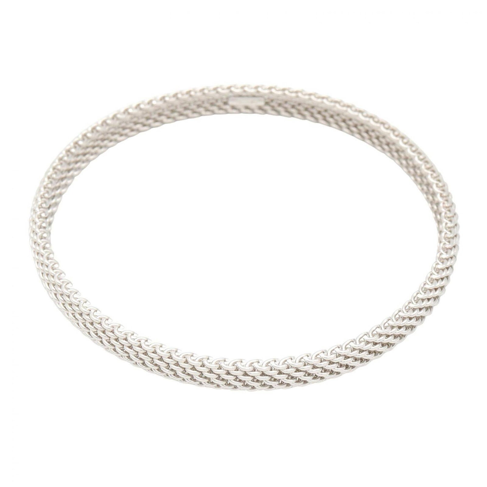 TIFFANY Bangle White Gold (18K): TIFFANY Bangle White Gold (18K) This Tiffany bangle is crafted from 18K white gold, offering a sleek and sophisticated silver finish. With a gently used condition and minor signs of wear, it retains i