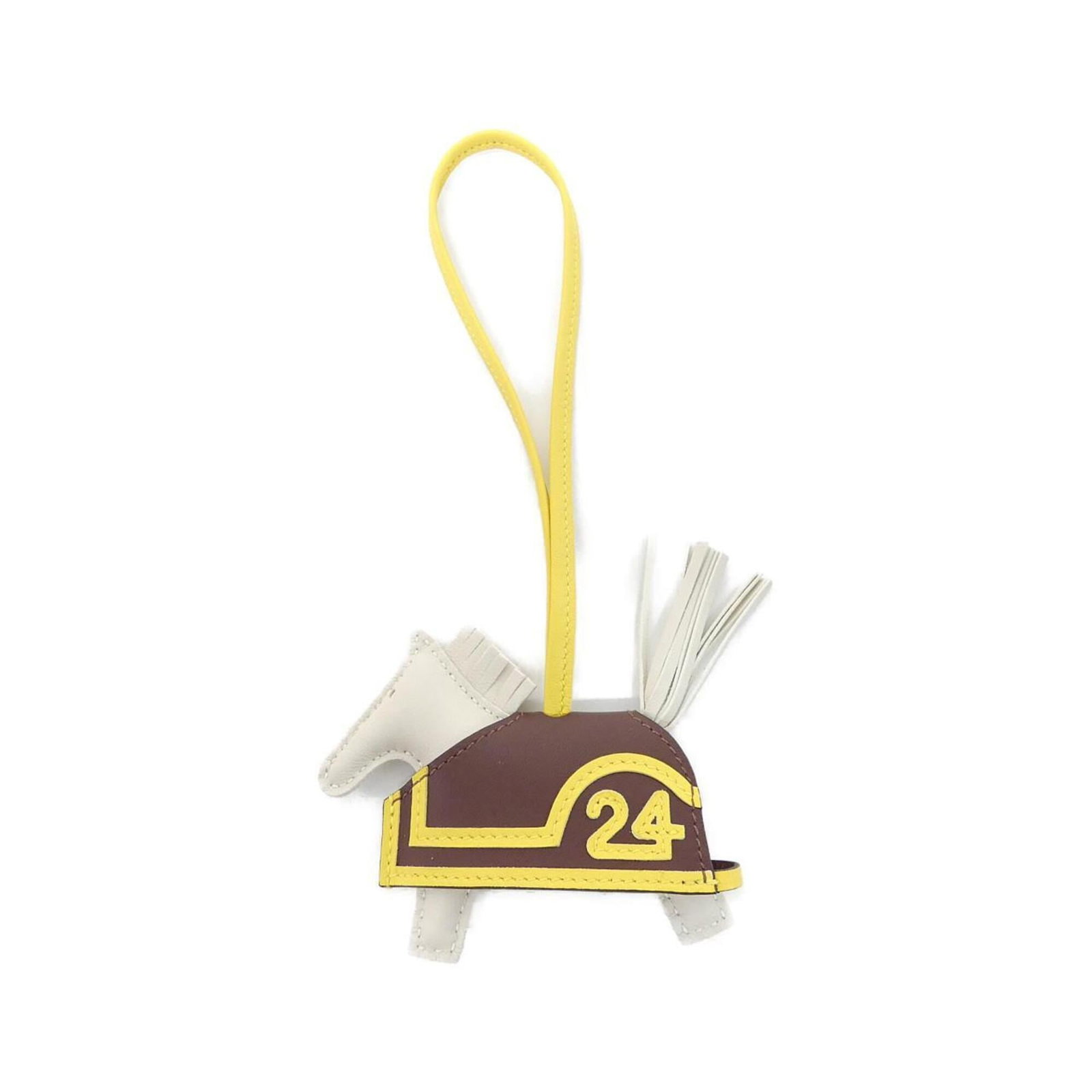 HERMES Handbag Charm Agneau Milo Swift Leather: HERMES Handbag Charm Agneau Milo Swift Leather Agneau Milo Swift Leather Handbag Charm from Hermes - A Gently Used Gem. This beautifully crafted charm features Agneau Milo, Swift leather in a