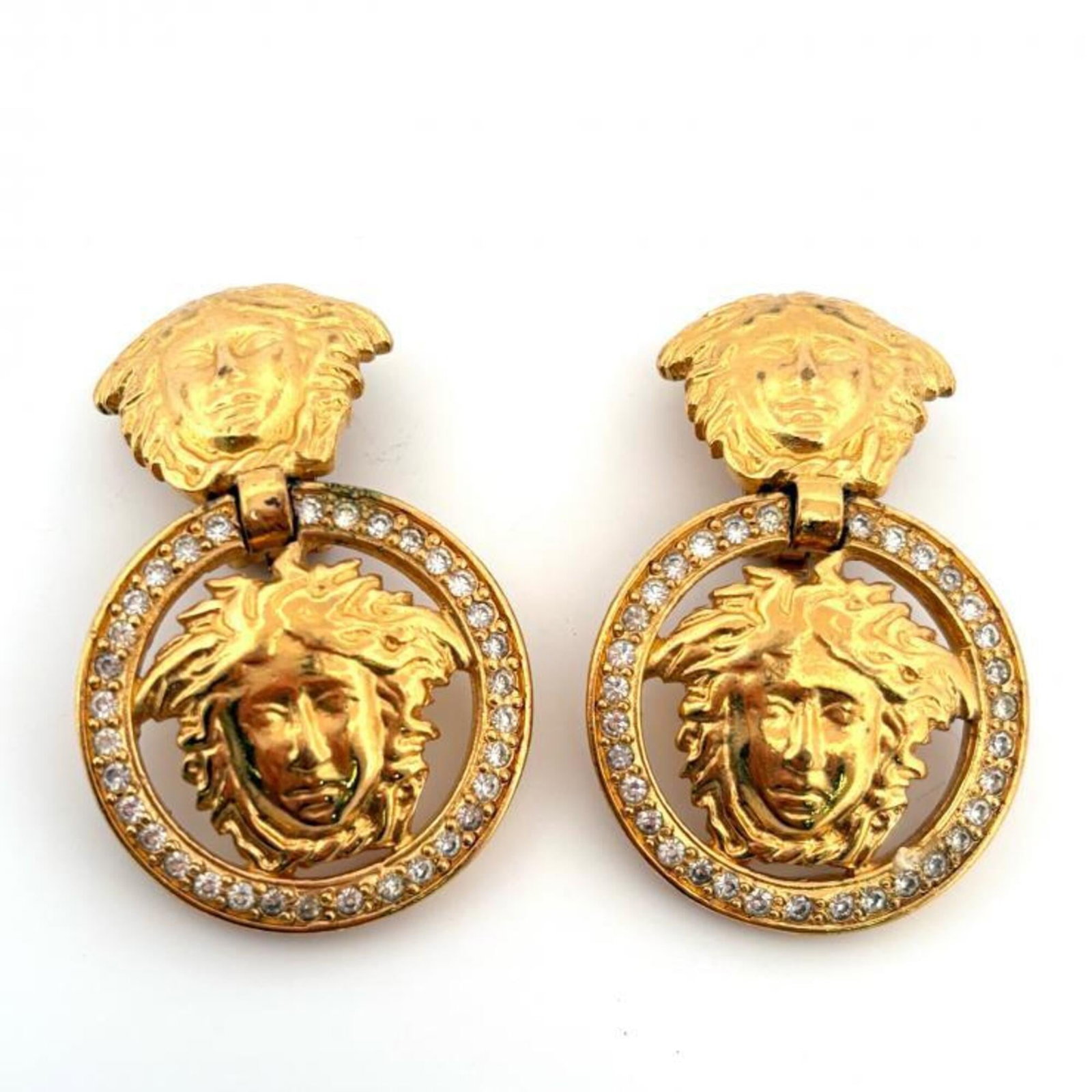 VERSACE Clip Earrings Gold Plating: VERSACE Clip Earrings Gold Plating Gold Plating Earrings from Versace. Made from gold plating, these clip earrings feature a sleek design that adds a touch of luxury to any outfit. With visible wear