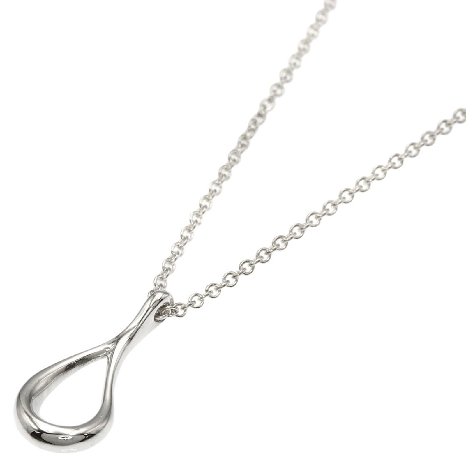 TIFFANY Silver Necklace: TIFFANY Silver Necklace Tiffany's silver necklace boasts a sleek design with a 15.8mm x 7mm pendant, set against a 41cm / 16.14'' chain. The necklace has been gently used, with minor signs of wear, in