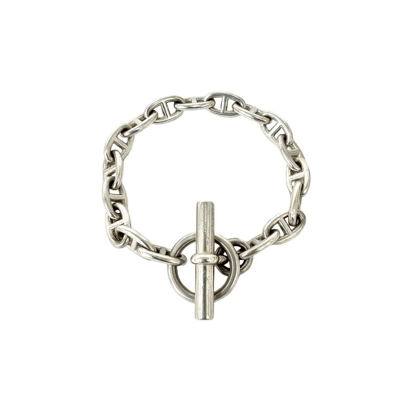HERMES Charm Bracelet Silver 925: HERMES Charm Bracelet Silver 925 Silver 925 charm bracelet from Hermes features a classic design. The 19.3cm length showcases a silver charm bracelet with visible wear, including scratches and