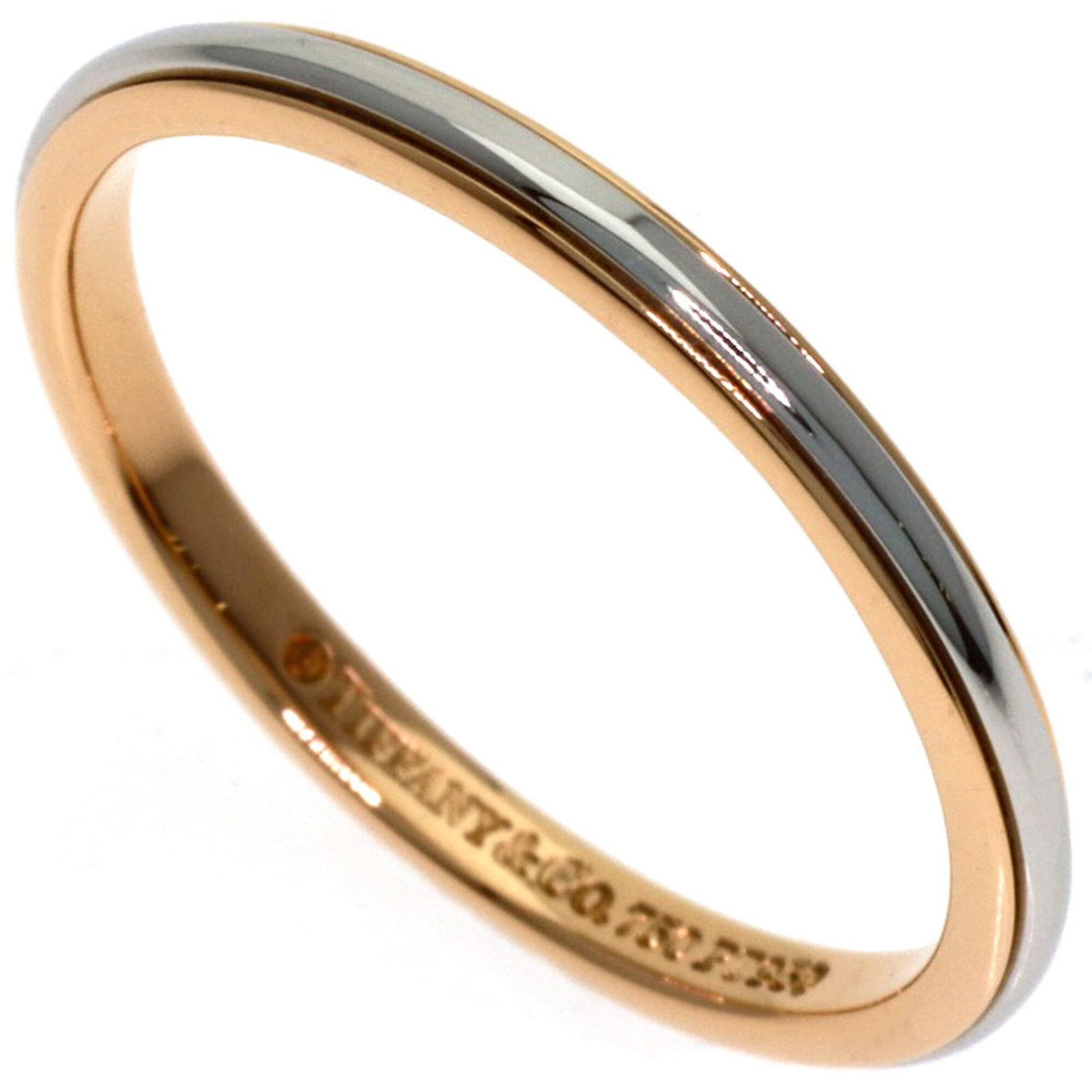 TIFFANY Band Ring Pink Gold (18K): TIFFANY Band Ring Pink Gold (18K) Pink gold (18K) band ring from Tiffany, featuring a delicate design that adds a touch of elegance to any outfit. The ring is in very good condition, with minor signs 