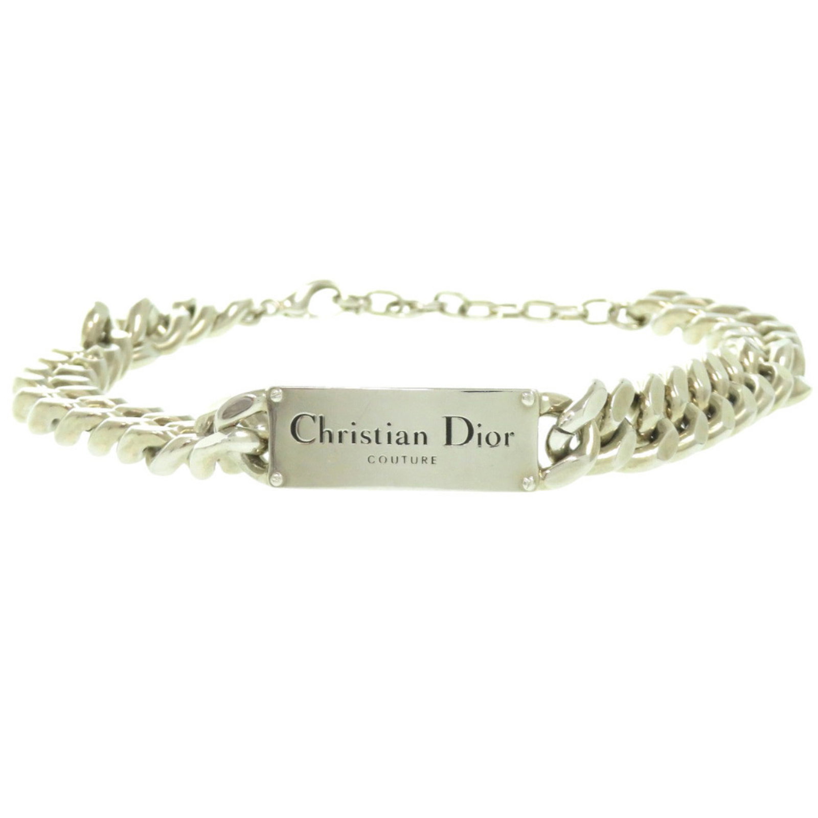 CHRISTIAN DIOR Metal: CHRISTIAN DIOR Metal Silver Christian Dior Metal Necklace with Visible Wear. This 43.5 cm long necklace features a 57mm x 15mm metal pendant and is made of silver metal. The necklace is in good used
