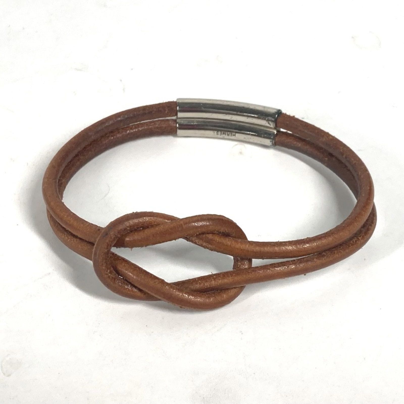 HERMES Charm Bracelet Leather: HERMES Charm Bracelet Leather Brown leather charm bracelet from Hermes, measuring 18cm in length, with minor signs of wear and small scratches. Gently used in very good condition. Item Specifics: