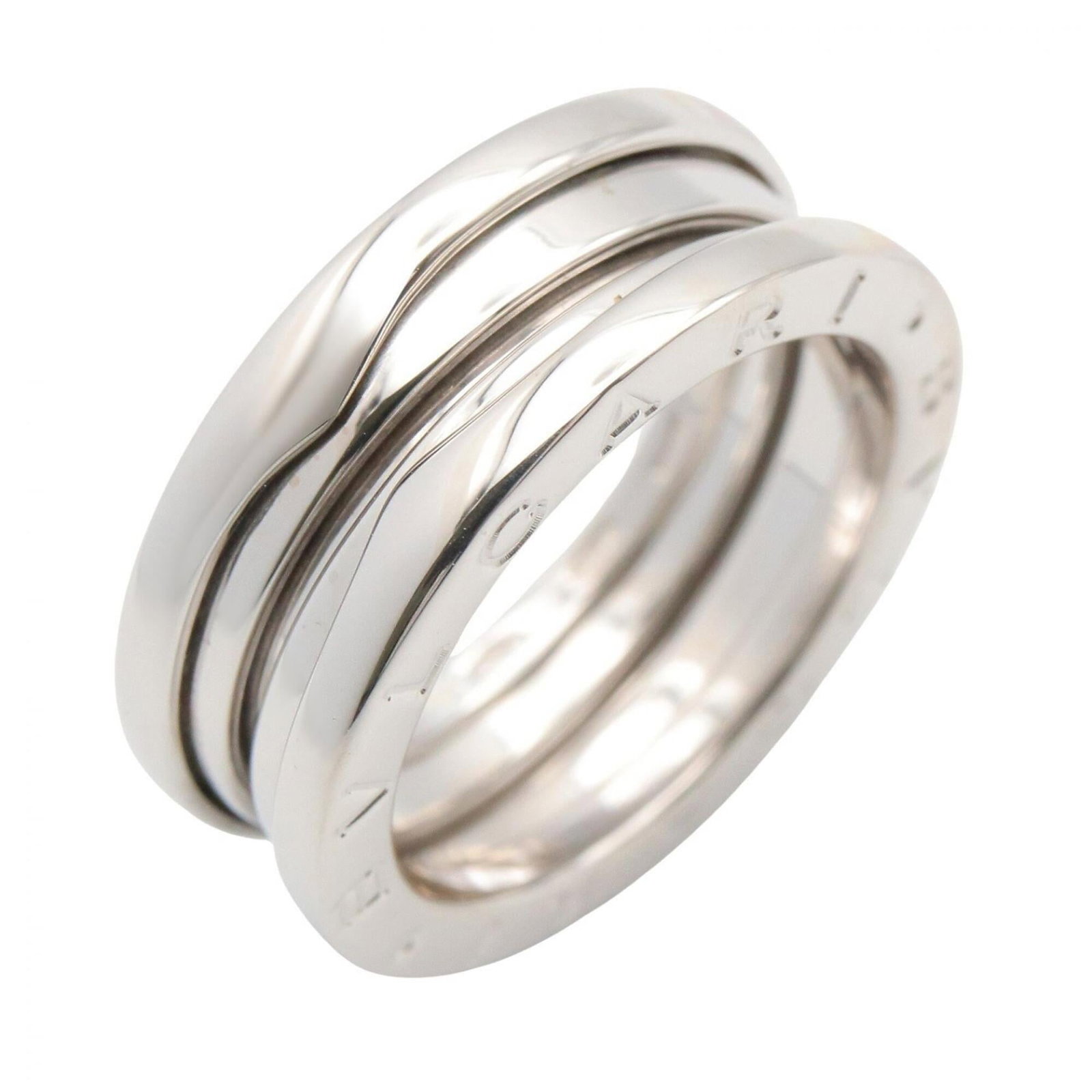 BVLGARI Band Ring White Gold (18K): BVLGARI Band Ring White Gold (18K) Bvlgari Band Ring White Gold (18K) is a stylish silver band ring crafted from 18K white gold. The ring features a classic design with a simple band style, suitable