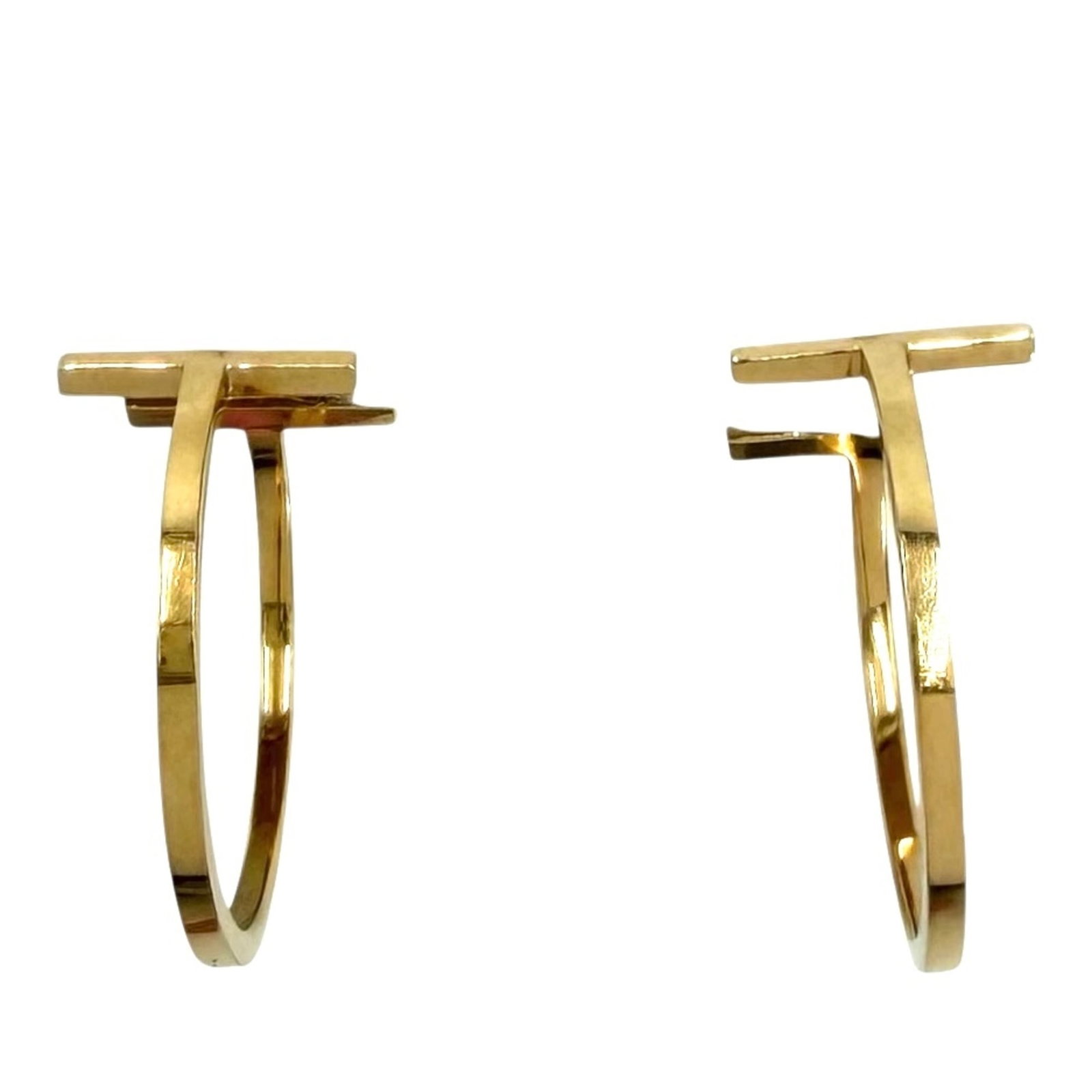 TIFFANY Hoop Earrings Yellow Gold (18K): TIFFANY Hoop Earrings Yellow Gold (18K) Yellow gold (18K) hoop earrings with a classic design, bearing a signature. Measuring 22.00mm in diameter, these earrings are made from 18K yellow gold and