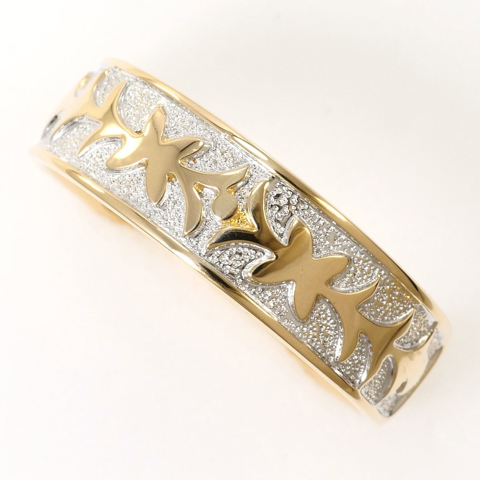 Band Ring White Gold (10K) Yellow Gold (10K): Band Ring White Gold (10K) Yellow Gold (10K) This 10K white gold and yellow gold band ring is a versatile and elegant option for everyday wear. Made from high-quality 10K gold, it features a slim 6mm