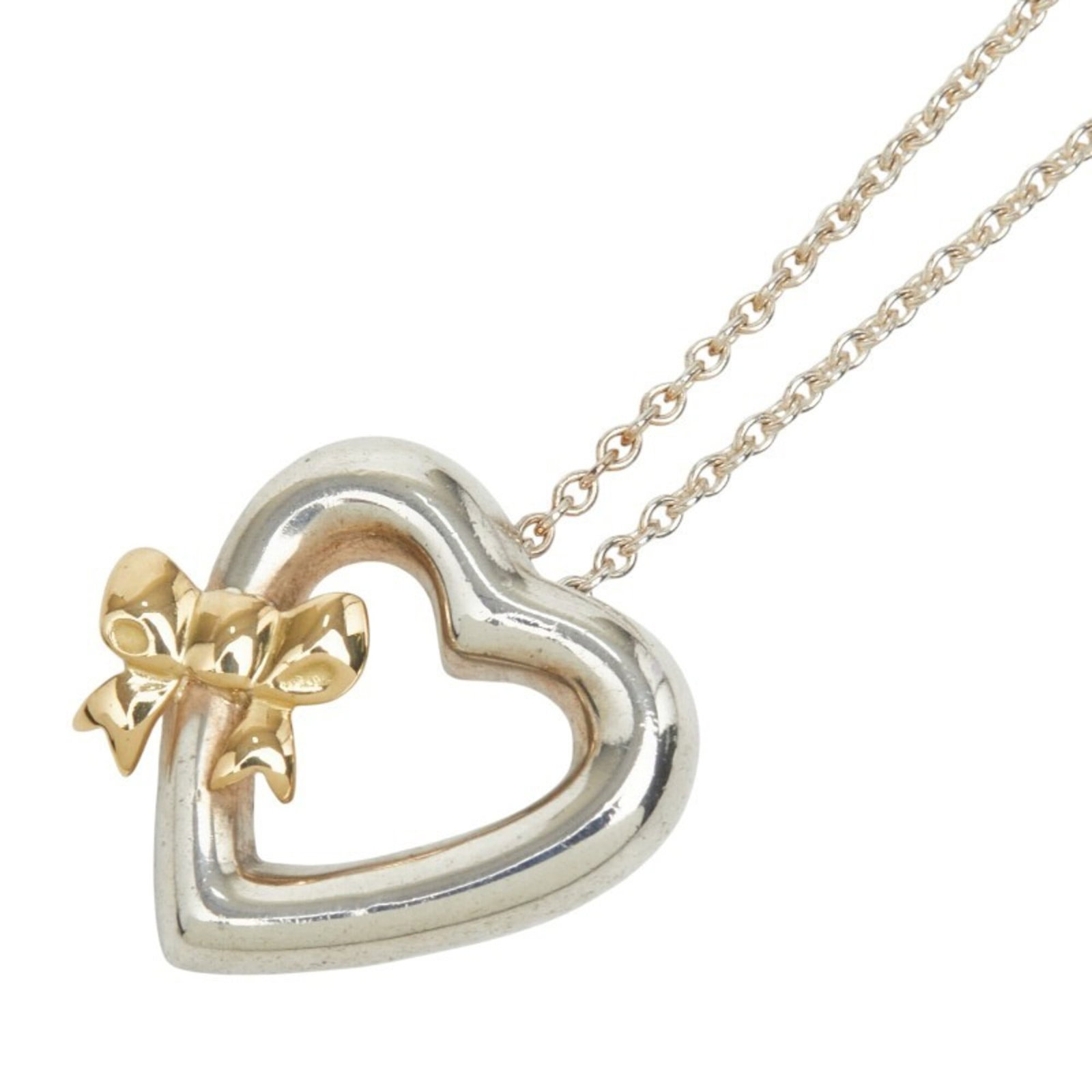 TIFFANY Silver 925 Yellow Gold (18K): TIFFANY Silver 925 Yellow Gold (18K) Silver 925 Yellow Gold (18K) Tiffany Necklace. This 18K yellow gold necklace features a 19.4mm x 20.1mm pendant made from silver 925 and yellow gold, set on a 46 c