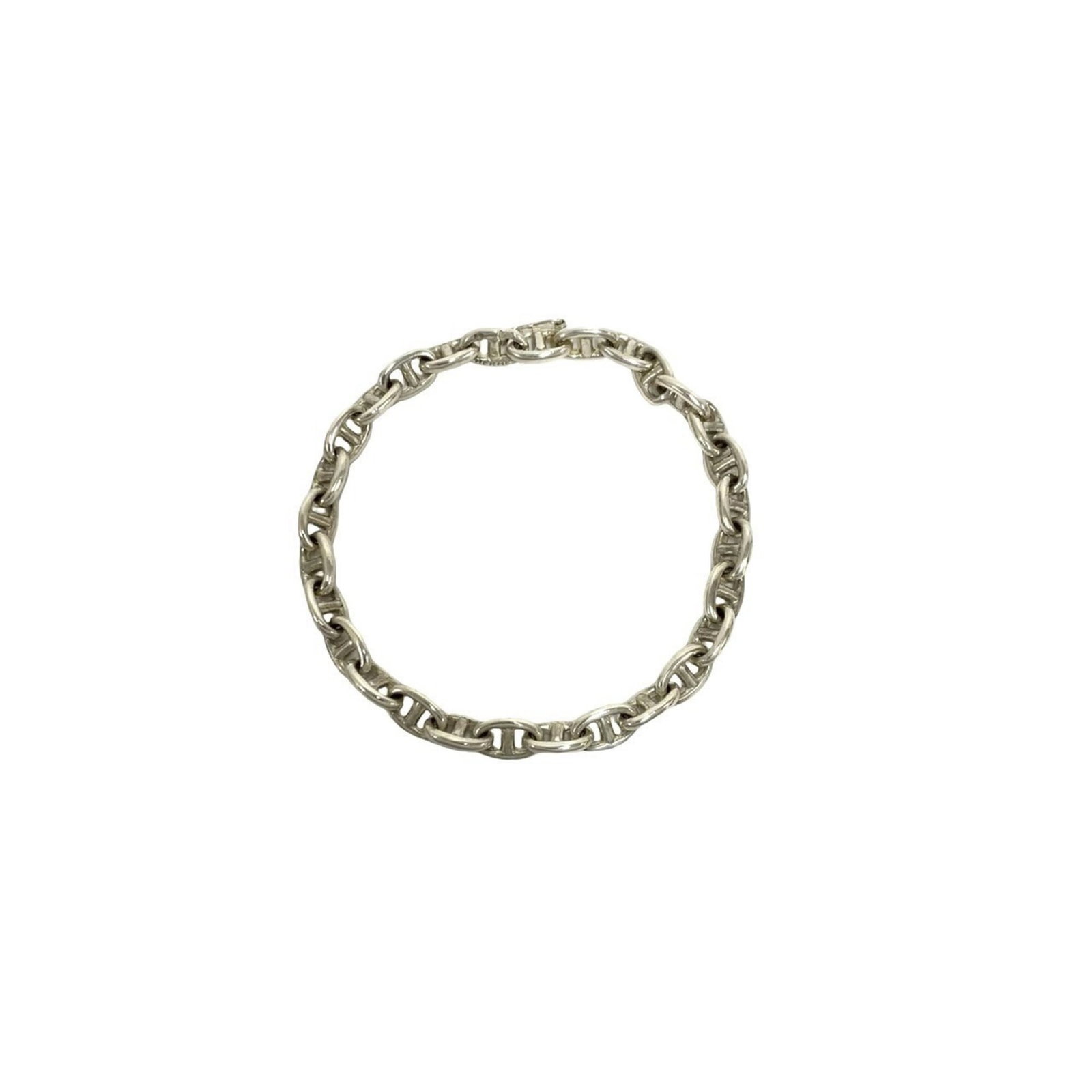 HERMES Charm Bracelet Silver 925: HERMES Charm Bracelet Silver 925 Silver 925 Charm Bracelet from Hermes Features a classic charm bracelet design in sterling silver, measuring 19cm in length. The item has visible wear, including scrat