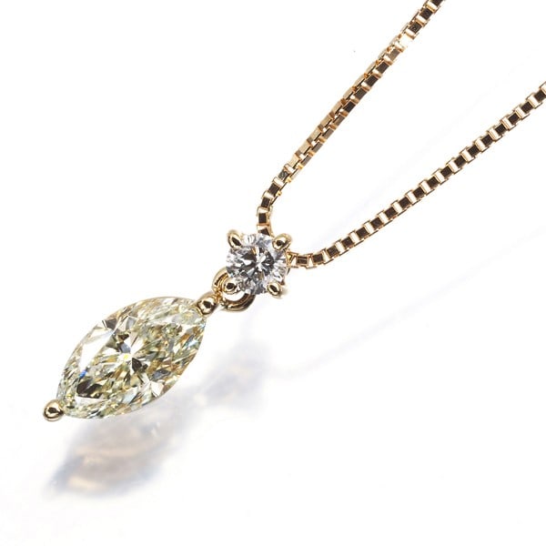 Tasaki Necklace Yellow & Clear Diamond 0.66Ct/0.06Ct Marquise Cut 18K Yg: Tasaki Necklace Yellow & Clear Diamond 0.66Ct/0.06Ct Marquise Cut 18K Yg Yellow and clear diamonds sparkle in this 18k yellow gold marquise-cut pendant necklace. The necklace features a 0.66ct yellow