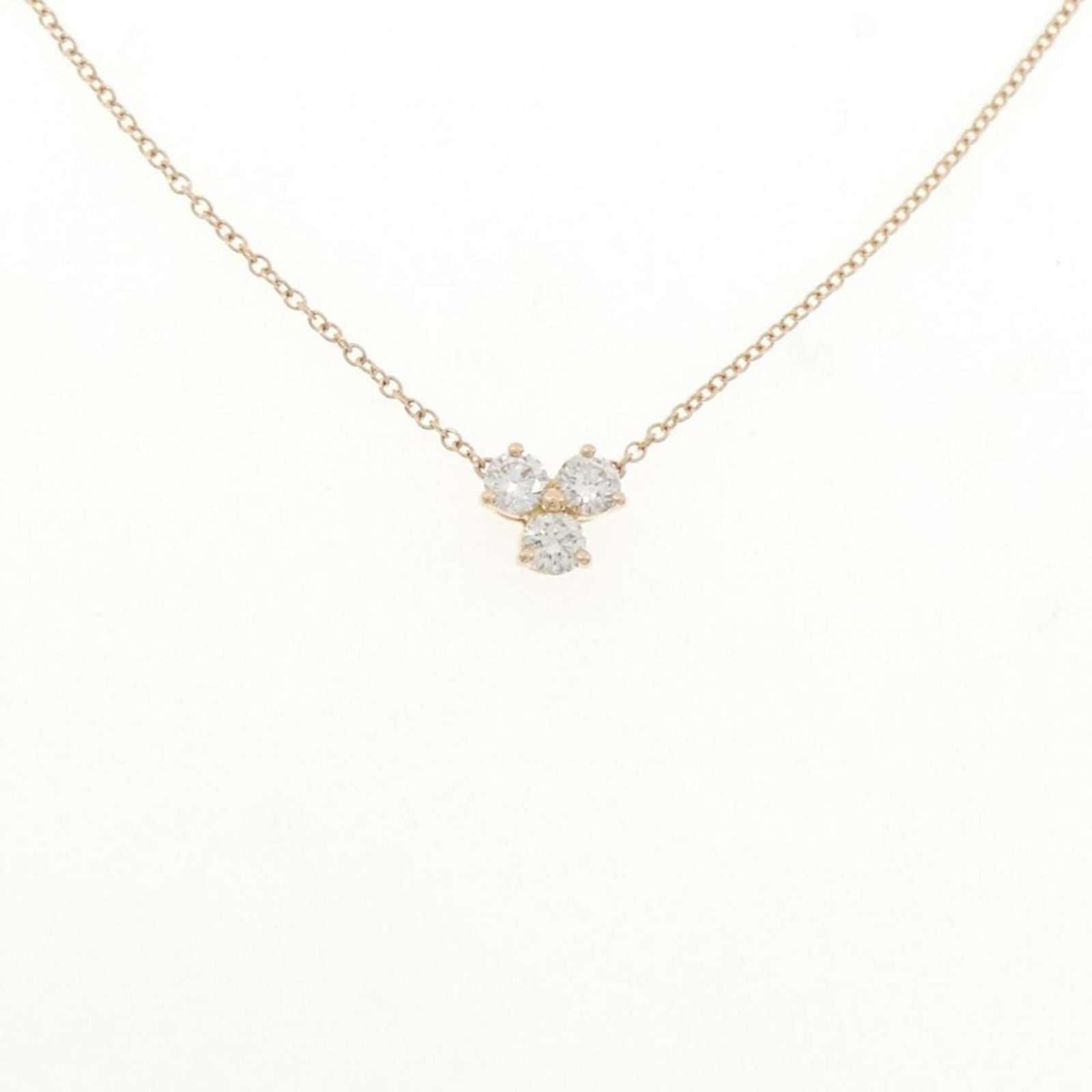 TIFFANY Pink Gold (18K): TIFFANY Pink Gold (18K) Pink gold (18K) pendant features a diamond set in a beautiful Tiffany necklace. The pendant measures 6.4mm x 7mm and is set within a necklace with a circumference of 41 cm.