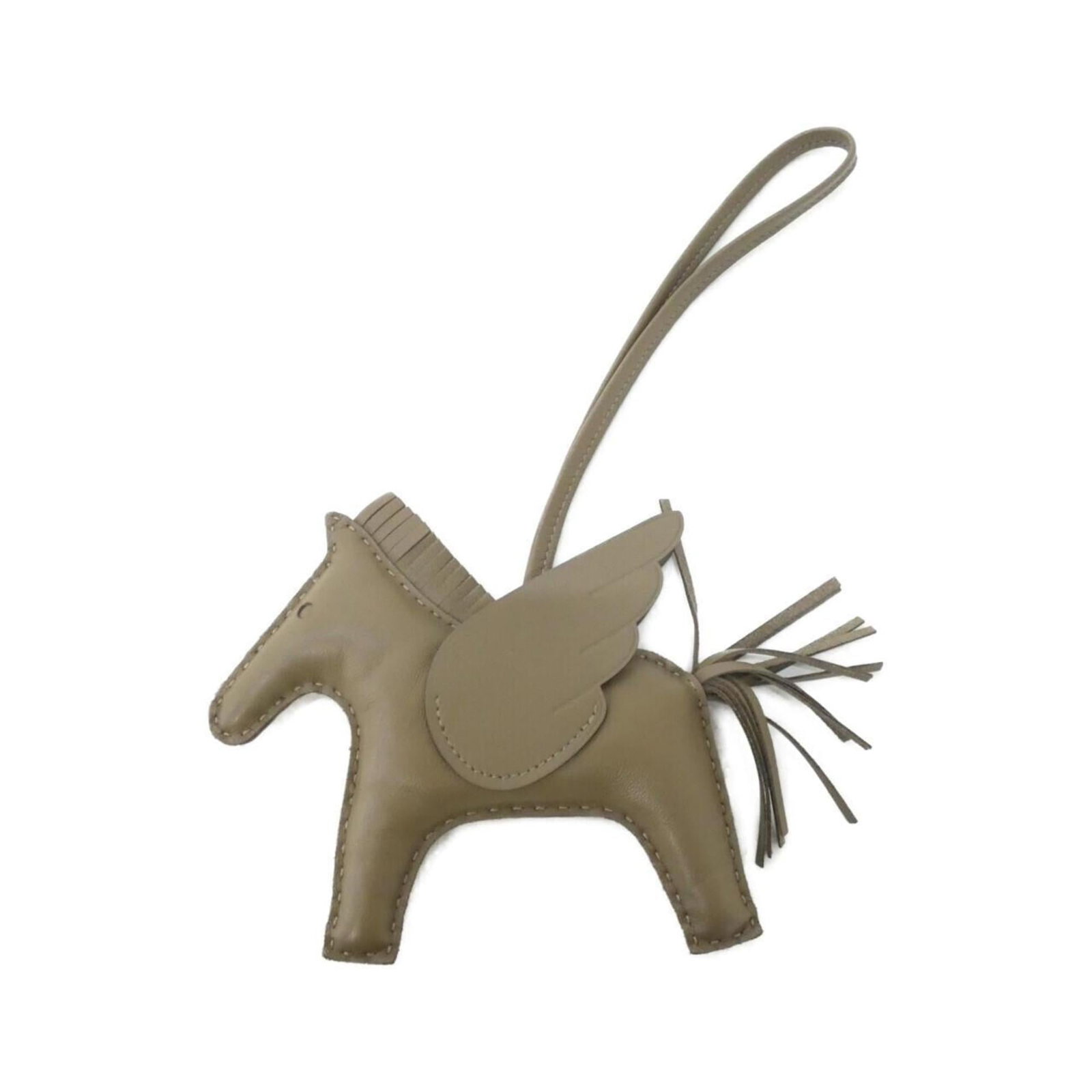 HERMES Handbag Charm Agneau Milo: HERMES Handbag Charm Agneau Milo Agneau Milo Handbag Charm by Hermes features a sleek, etoupe gray finish. Made from this unique material, the charm boasts a distinctive look that sets it apart. With 