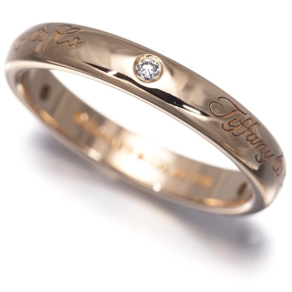Tiffany&Co. Ring Diamond Noteslucida 3P Us5-5.25 18K 750 Rose Gold: Tiffany&Co. Ring Diamond Noteslucida 3P Us5-5.25 18K 750 Rose Gold Tiffany & Co.'s 18k rose gold ring features a natural diamond with a carat weight unmarked, set in a band with a 3.1mm width. The rin