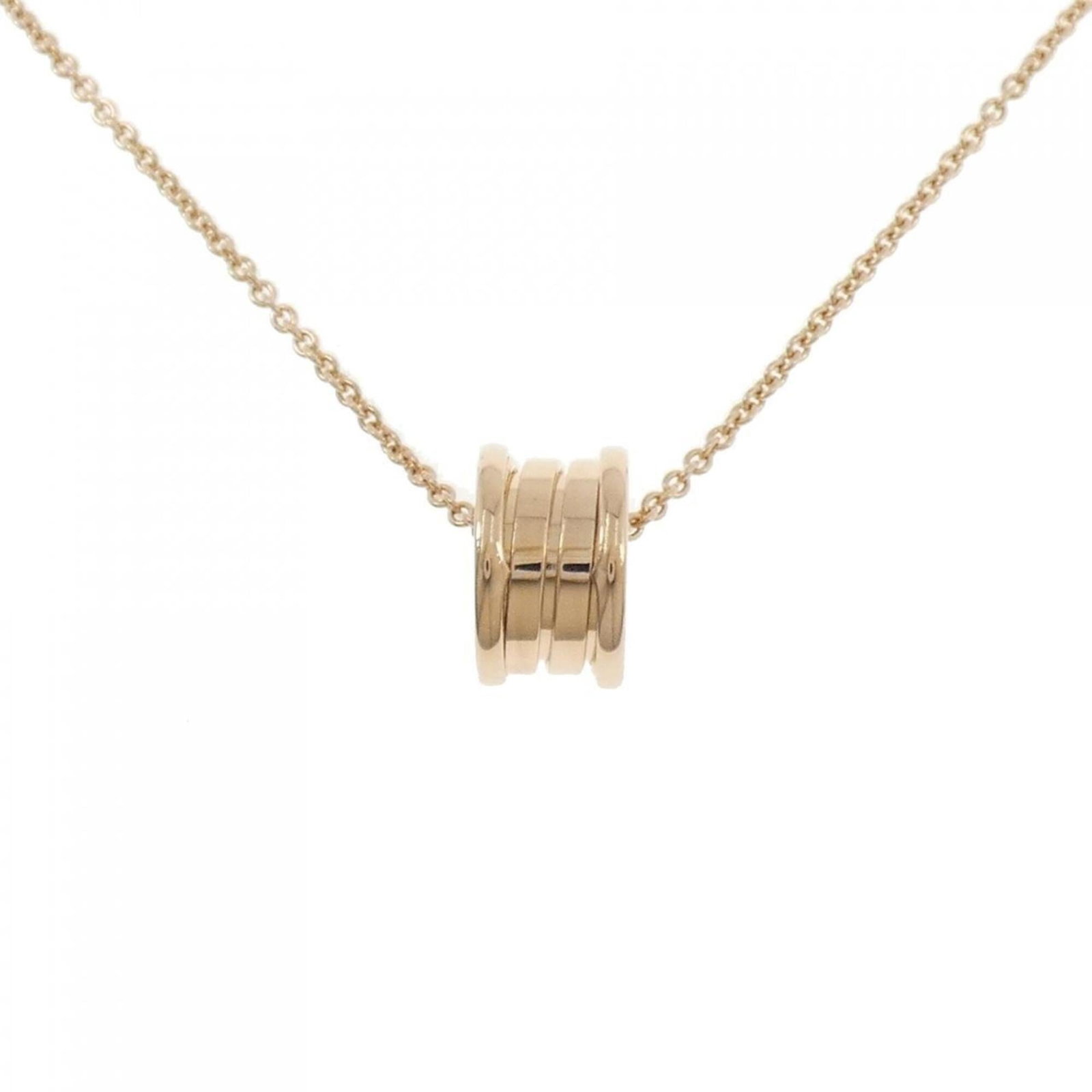 BVLGARI Pink Gold (18K): BVLGARI Pink Gold (18K) Pink gold BVLGARI necklace with a pendant, crafted from 18K gold, features a delicate design in a soft pink hue. The necklace's adjustable length allows for a comfortable fit,