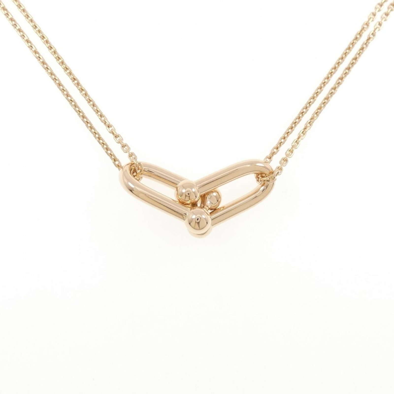 TIFFANY Pink Gold (18K): TIFFANY Pink Gold (18K) Pink gold (18K) pendant necklace from Tiffany, featuring a 12.3mm x 28mm pendant suspended from a 41 cm / 16.14'' chain. This necklace is in like new condition, with only the f