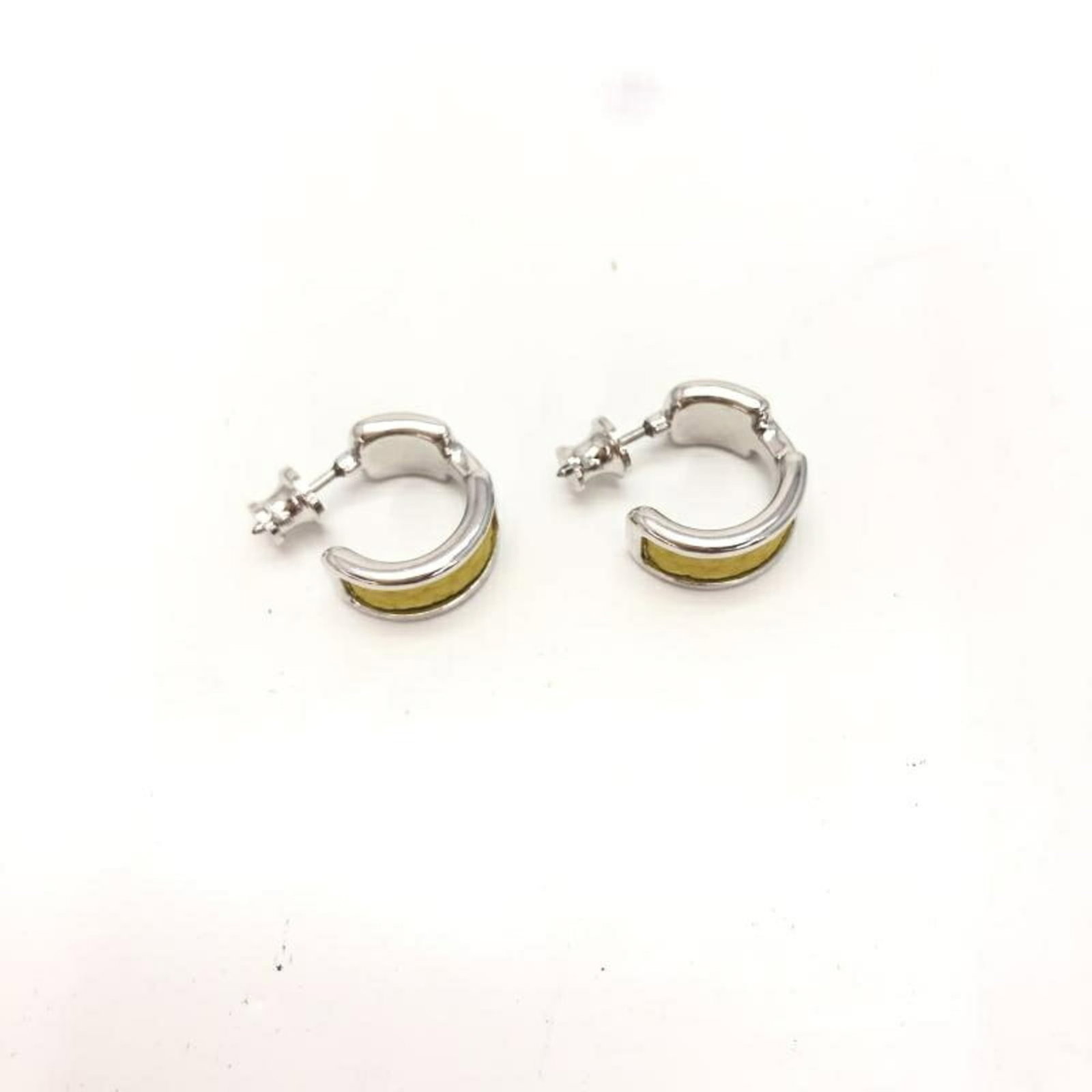HERMES Hoop Earrings Silver: HERMES Hoop Earrings Silver Silver hoop earrings from the Hermes brand, featuring a 15mm diameter and 0.59'' x 0.59'' dimensions. The earrings bear visible scratches, scuffs, and dirt, but remain