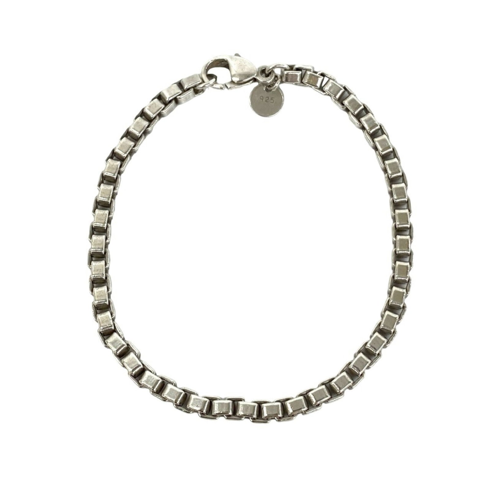 TIFFANY Charm Bracelet Silver 925: TIFFANY Charm Bracelet Silver 925 Silver 925 Charm Bracelet from Tiffany, featuring a classic design with visible wear and scratches. This 18cm long charm bracelet is made from high-quality silver and